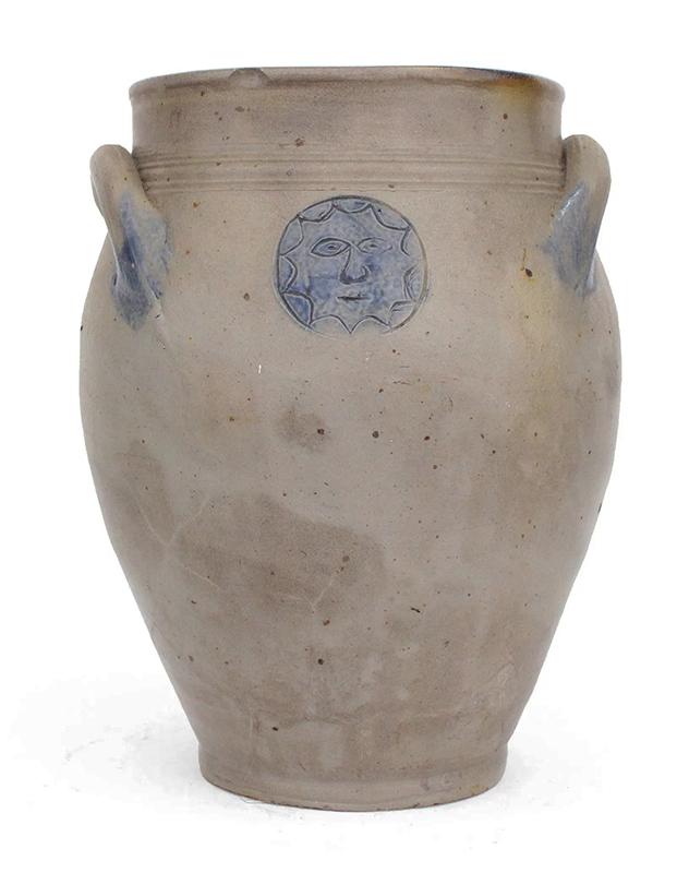 Stoneware Jar w/Sun Face Decoration